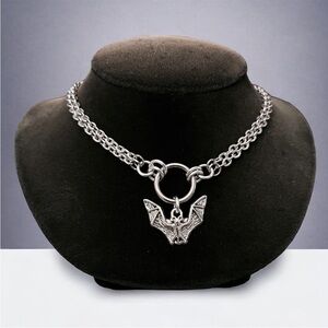 Double chain stainless steel cable link with Silver plated bat vampire charm .